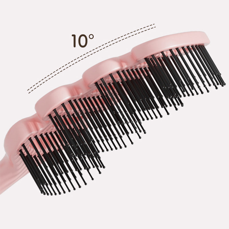 Cepillo de pelo con ventilación curva
