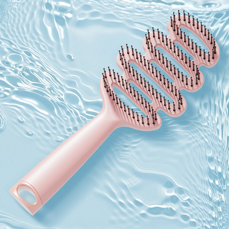 Cepillo de pelo con ventilación curva