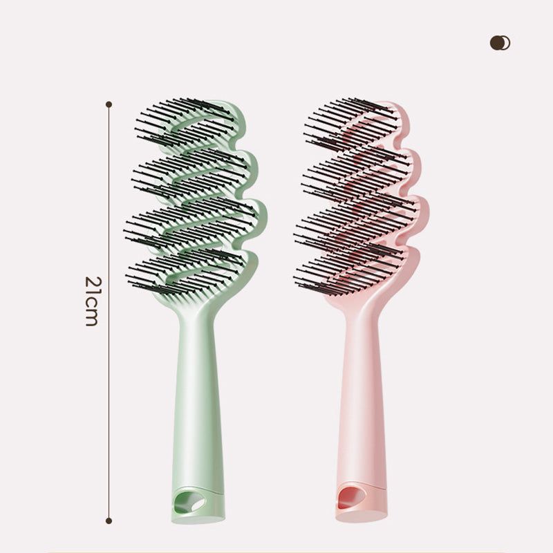 Cepillo de pelo con ventilación curva