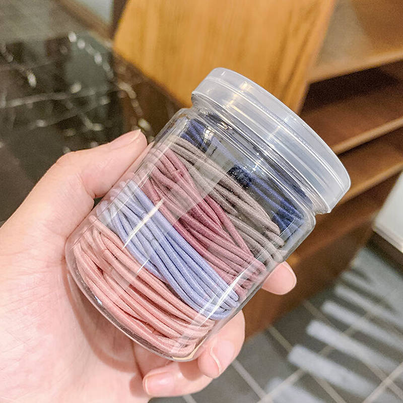 100 coleteros elásticos para el pelo en frasco