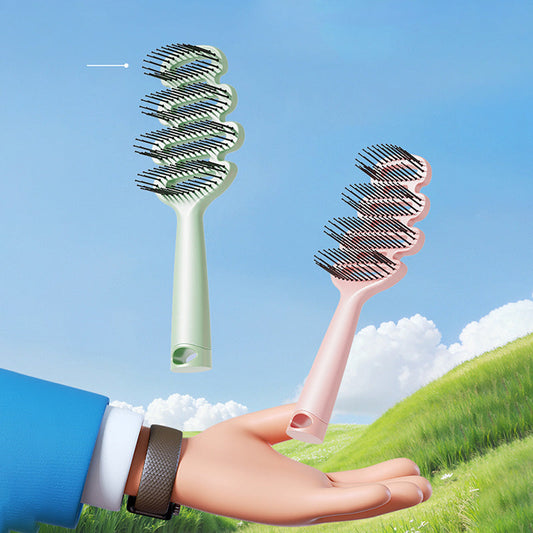 Cepillo de pelo con ventilación curva